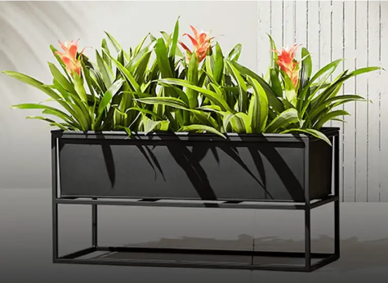 Sleek rectangular metal planter with vibrant flowers by Urbanland Products – Metal Planter Manufacturer in India